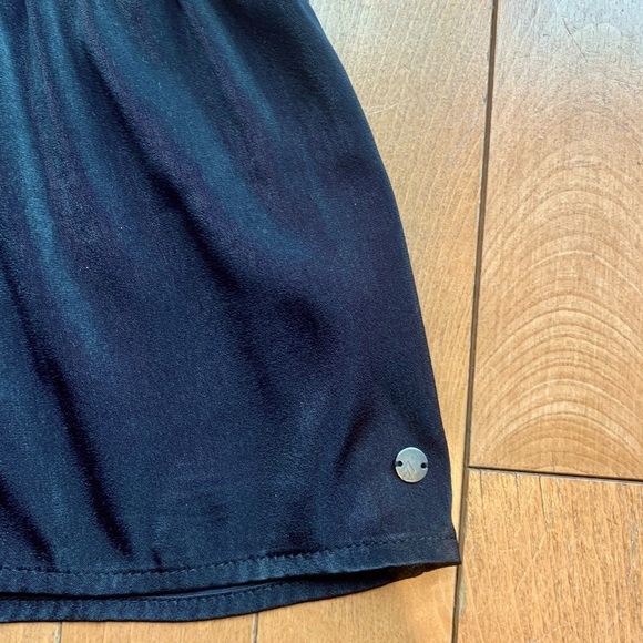 Shiny black peplum top! Loose fitting. Ripzone brand. Size small/medium. - Picture 4 of 5